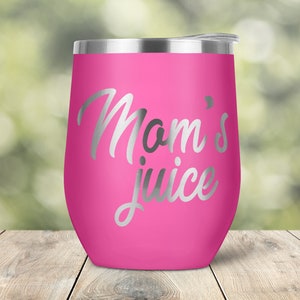 May include: Pink stainless steel wine tumbler with a silver inscription that reads "Mom's juice".