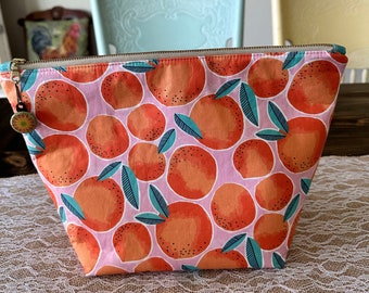 Large orange themed cosmetic bag travel bag makeup bag with funky zipper pull