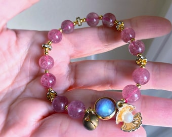 Pulsera de cuarzo fresa y labradorita con concha carmesí de Afrodita: exactamente la que se muestra en las imágenes.