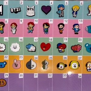 May include: A set of 35 colorful, cartoon-style shoe charms featuring characters from the popular K-pop group BTS, including BT21 characters, the group's logo, and the word "BTS".