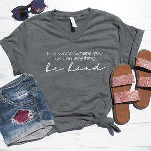 In A World Where You Can Be Anything Be Kind V-Neck Tee - Kindness V-Neck - Mom V-Neck Tee - Weekend V-Neck - Graphic Vneck Tee - Unisex Fit