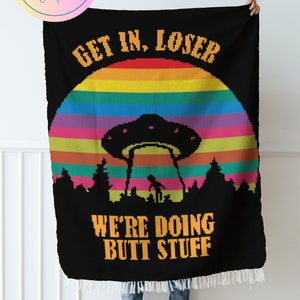 May include: A black crochet blanket with a rainbow sunset, a UFO, and the text "Get in, loser. We're doing butt stuff".