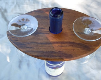 Wine glass display / centerpiece that will hold two glasses on top of a wine bottle for a unique look and touch of class