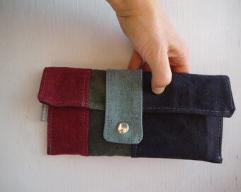 Bolso de mano tipo sobre de lona encerada