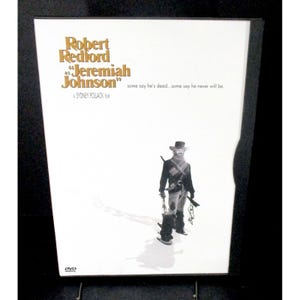 May include: DVD case for the film "Jeremiah Johnson" starring Robert Redford. The cover features the film's title in gold lettering, a black and white image of a man in a hat, and the text "some say he's dead...some say he never will be."