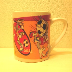 Warner Brothers-Looney Tunes-Bugs Bunny Playing Soccer-Coffee Mug-Gibson