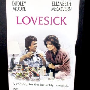 May include: DVD case for the movie Lovesick, featuring Dudley Moore and Elizabeth McGovern. The cover has a photo of the actors and the tagline "A comedy for the incurably romantic."