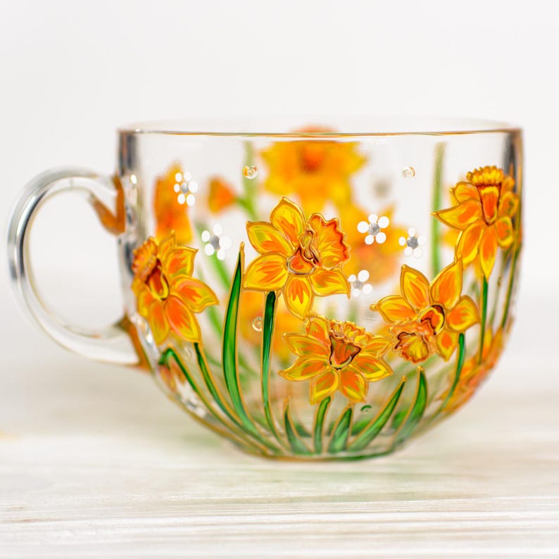 Yellow daffodil design on a clear glass mug, representing March birth flower.