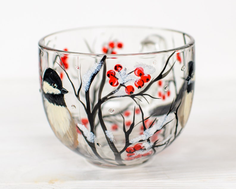 Winter bird mug with chickadee and red berry branches.