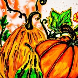 May include: A glass surface featuring a hand-painted illustration of two large orange pumpkins and a smaller green and yellow gourd. The design includes black outlines, vibrant green leaves, and curly vines against a translucent background.