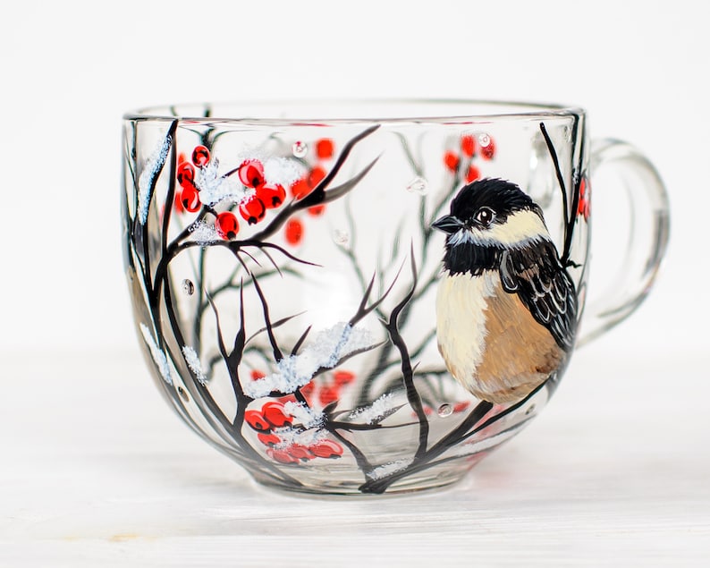 Chickadee cup with large bird portrait and winter branches.