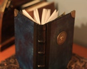 The Mermaid Book: Hand bound blue leather journal with brass compass, brass shell corners, and paintings within