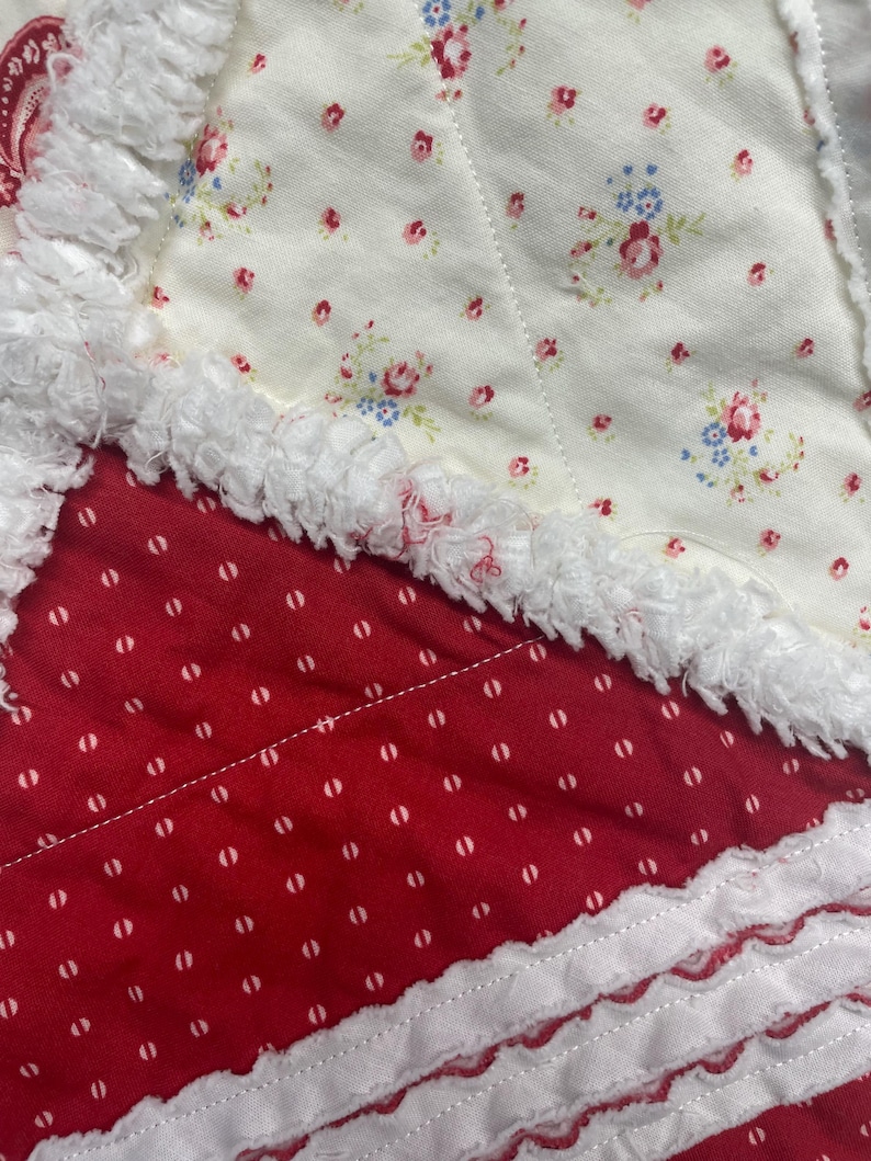 May include: A white ceramic mug with a black handle and the text "But First, Coffee" in a bold, black font. The mug is set against a neutral background, highlighting its simple design.