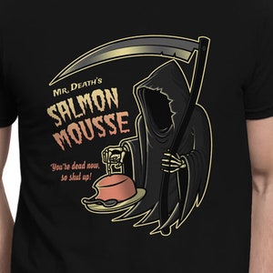 May include: Black t-shirt featuring a graphic of the Grim Reaper holding a plate of salmon mousse. The text reads "Mr. Death's Salmon Mousse. You're dead now, so shut up!"