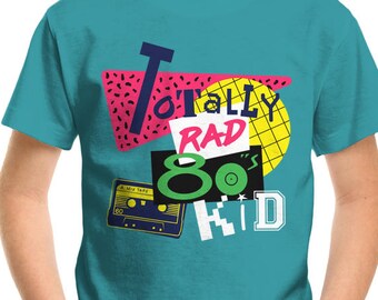 May include: A turquoise blue t-shirt with a graphic print of a cassette tape, a record, and the text "Totally Rad 80's Kid".