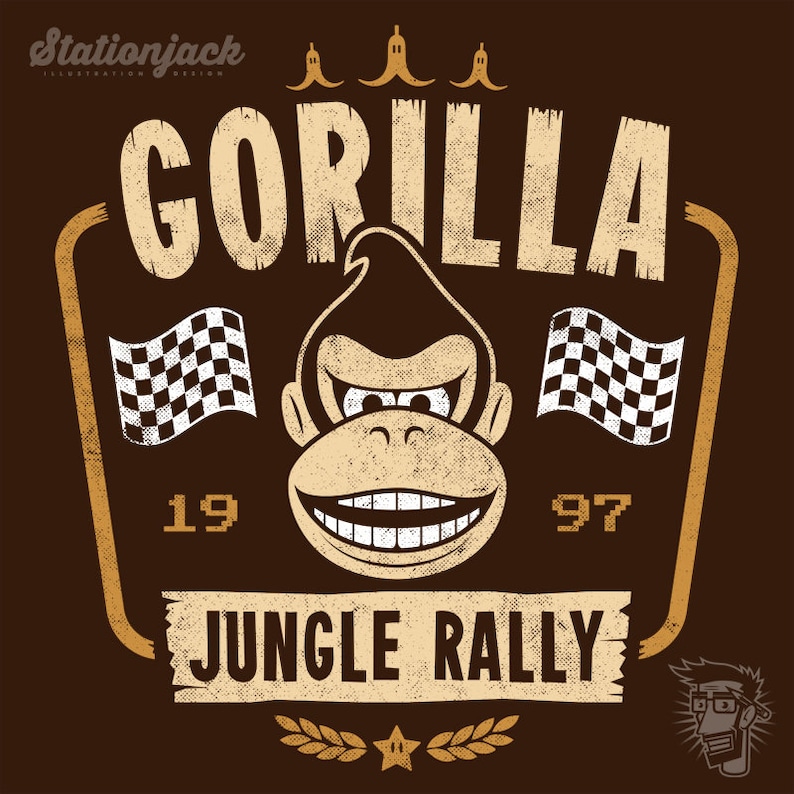 May include: A vintage-style graphic with a distressed brown background featuring a cartoon gorilla with a toothy grin. The text "GORILLA" is above the gorilla, and "JUNGLE RALLY" is below. The text "19" and "97" are on either side of the gorilla. There are three yellow bananas at the top of the graphic.