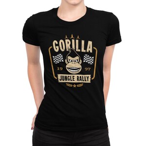 May include: Black t-shirt with a vintage-style graphic of a gorilla wearing a racing helmet and the text "Gorilla Jungle Rally" with the numbers 19 and 97.