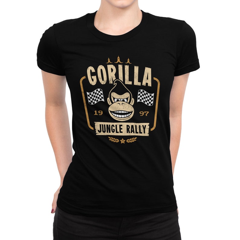 May include: Black t-shirt with a vintage-style graphic of a gorilla wearing a racing helmet and the text "Gorilla Jungle Rally" with the numbers 19 and 97.