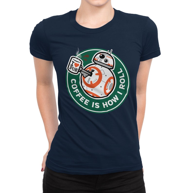 May include: A navy blue t-shirt with a green circle graphic featuring a droid character holding a coffee cup with the text "I love Poe" on it. The text around the droid reads "Coffee is how I roll."