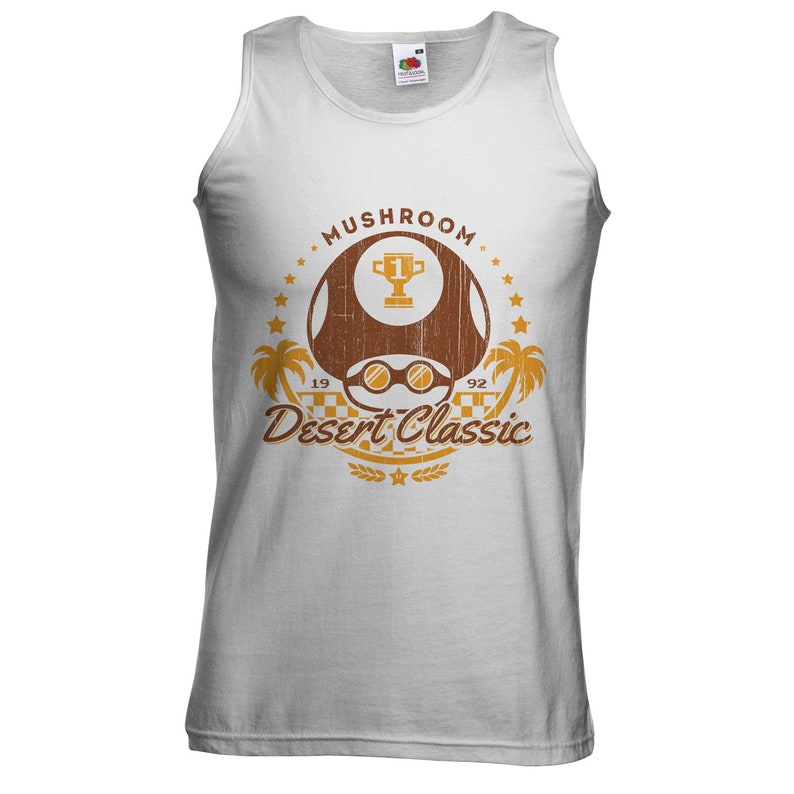 May include: White tank top with a brown graphic featuring a mushroom design, sunglasses, a trophy, palm trees, and the text "Mushroom Desert Classic 1992". The shirt is made of a soft material.