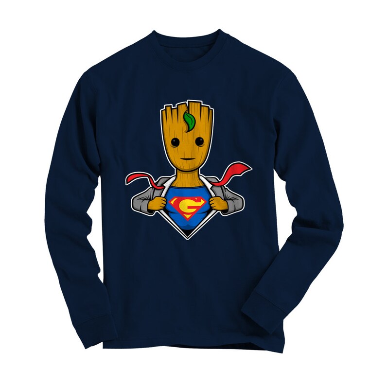 May include: Navy blue long-sleeve t-shirt featuring a cartoon image of a superhero Groot, a tree-like humanoid character from the Guardians of the Galaxy franchise, wearing a Superman costume. The image shows Groot ripping open his shirt to reveal the Superman symbol.