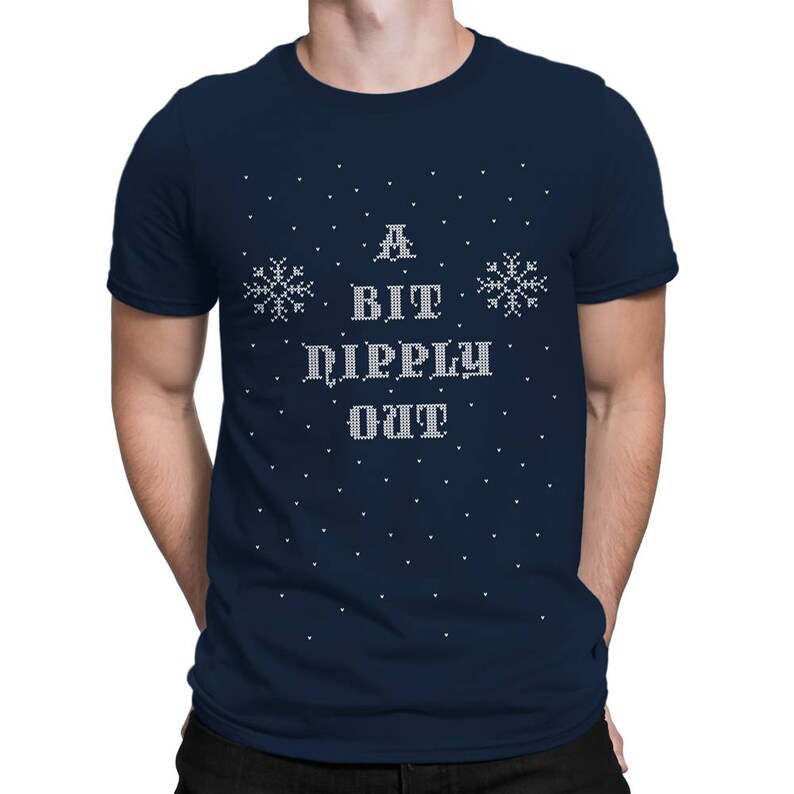 May include: A navy blue t-shirt with a white snowflake design and the text "A Bit Dippy Out" in a white, pixelated font.