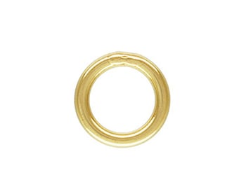 May include: A gold-colored jump ring, a metal ring used for connecting jewelry components.