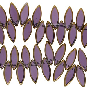 May include: A strand of purple glass beads with gold accents. The beads are shaped like leaves and have a glossy finish.