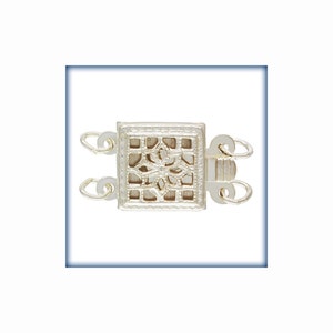 May include: Silver-toned square clasp with a decorative filigree design. The clasp has two loops on each side for attaching jewelry.