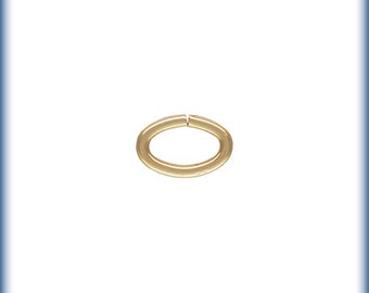 May include: A gold-colored jump ring, a small metal ring used for connecting jewelry pieces.