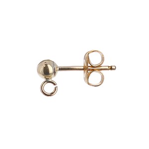 May include: Gold-toned earring with a small ball and a jump ring. The earring has a post back.