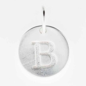 May include: Silver charm with the letter B engraved on a round disc.