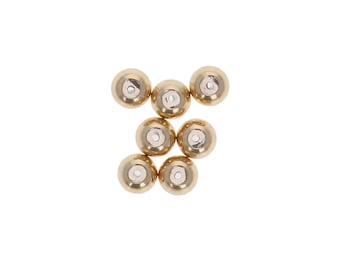 May include: Seven small, round, gold-colored beads with a silver-colored center. The beads are evenly spaced against a white background. These beads are likely used for jewelry making or other craft projects.