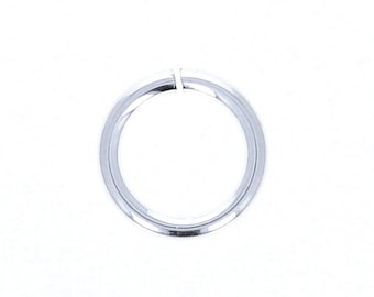 May include: A silver jump ring, a small metal ring used for connecting jewelry components.