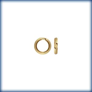May include: Two gold-colored jump rings, one open and one closed, for jewelry making.