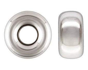 May include: Two silver-toned metal beads, one with a round hole and the other with a smooth, rounded surface.
