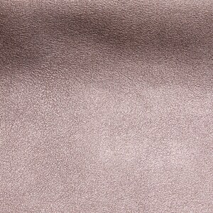May include: A close-up of a textured, metallic surface with a subtle, rose gold sheen.