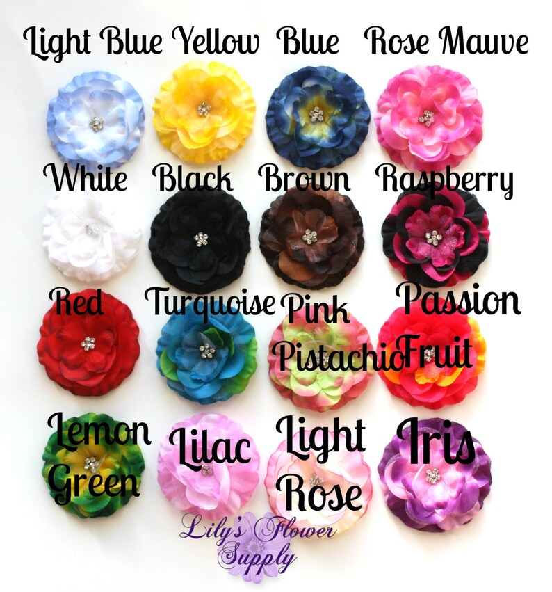 May include: Assortment of 15 fabric flower hair clips in various colors, including light blue, yellow, blue, rose, mauve, white, black, brown, raspberry, red, turquoise, pink, passion fruit, lemon green, lilac, light rose, and iris. Each flower has a rhinestone center.