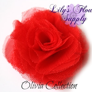 May include: A vibrant red tulle flower, resembling a rose, is the focal point. The flower is set against a white background. The image includes the text "Lily's Flower Supply" and "Olivia Collection".