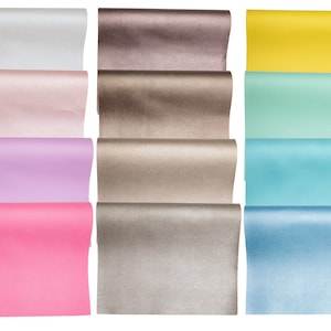 May include: A set of 10 rolls of colorful wrapping paper. The paper is metallic and has a shimmery finish. The colors include silver, pink, lavender, hot pink, brown, gold, yellow, light green, blue, and light blue.