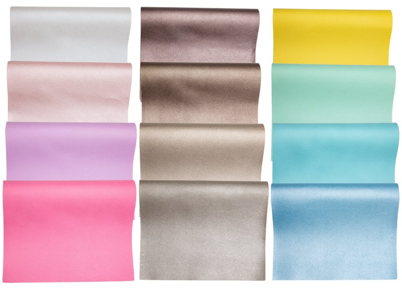 May include: A set of 10 rolls of colorful wrapping paper. The paper is metallic and has a shimmery finish. The colors include silver, pink, lavender, hot pink, brown, gold, yellow, light green, blue, and light blue.