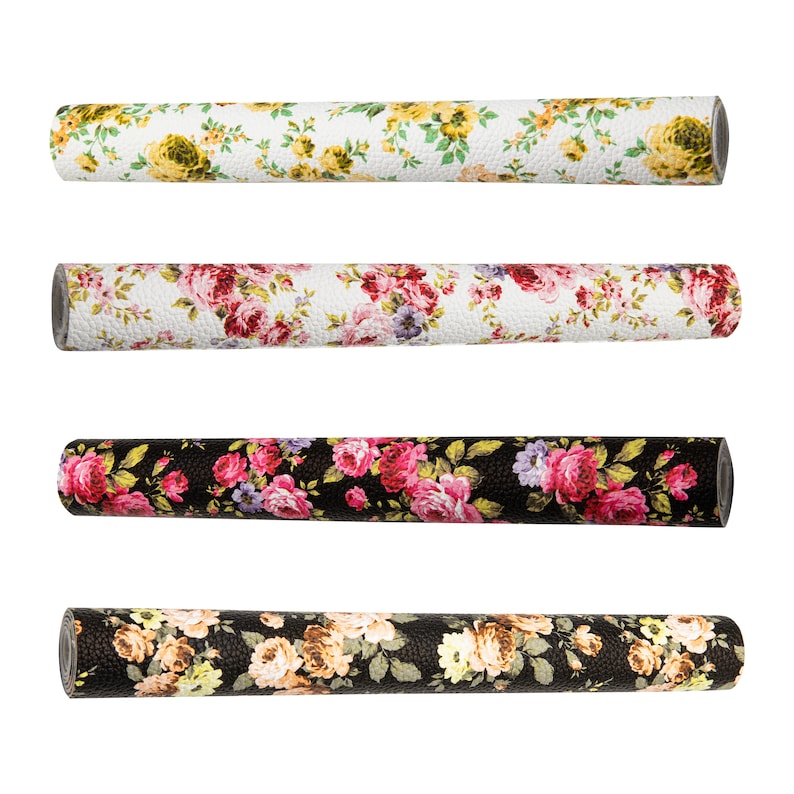 May include: Four rolls of floral patterned contact paper. The rolls are all the same size and have a white background with different colored floral patterns. The patterns include pink, red, yellow, and black flowers.