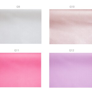 May include: Four fabric swatches in different colors: white, light pink, light purple, and light brown. The swatches are labeled Q9, Q10, Q11, and Q12.