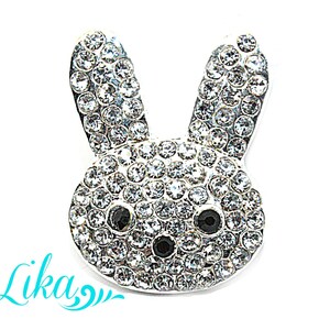 May include: A silver-toned rabbit charm with a face covered in clear rhinestones. The rabbit's eyes are black.