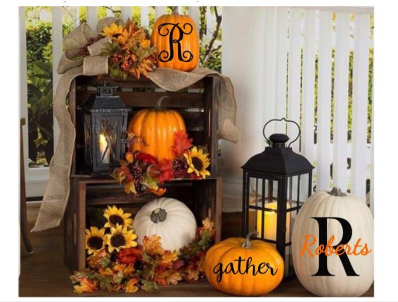 May include: Fall decor with pumpkins, sunflowers, and lanterns. The pumpkins are decorated with the letters "R" and "gather" and the text "Roberts".