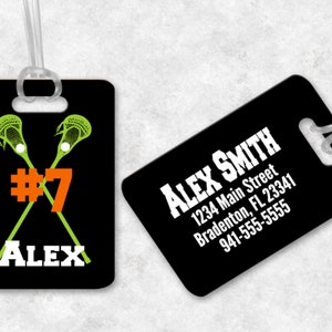 May include: Black luggage tag with white text that reads "Alex Smith" and contact information. The tag also features a green lacrosse stick graphic with the number "7" and the name "Alex" in white.