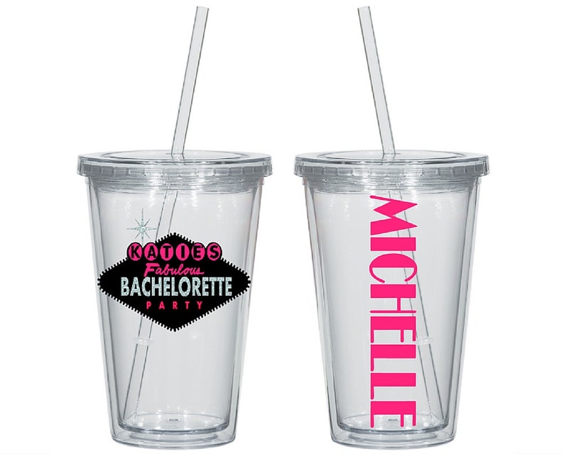 May include: Two clear plastic tumblers with lids and straws. One tumbler has the text "KATIE'S Fabulous BACHELORETTE PARTY" in black and pink on a black diamond shape. The other tumbler has the name "MICHELLE" in pink.
