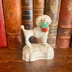 Antique English Dog Staffordshire Figurine Porcelain Curly Poodle Dog With Flower Basket Pedestal Base