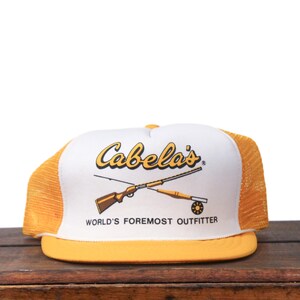 Vintage Cabela&#39;s World&#39;s Foremost Outfitters Hunting Fishing Outdoor Supplies Store Yellow Trucker Hat Snapback Baseball Cap