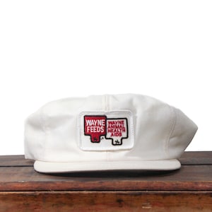 May include: A set of three ceramic mugs with a speckled, matte finish. The mugs are in shades of cream, light gray, and dark gray. Each mug has a simple, minimalist design, perfect for coffee or tea.